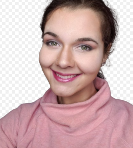 Chloe Crull is seen smiling with a pink turtleneck.